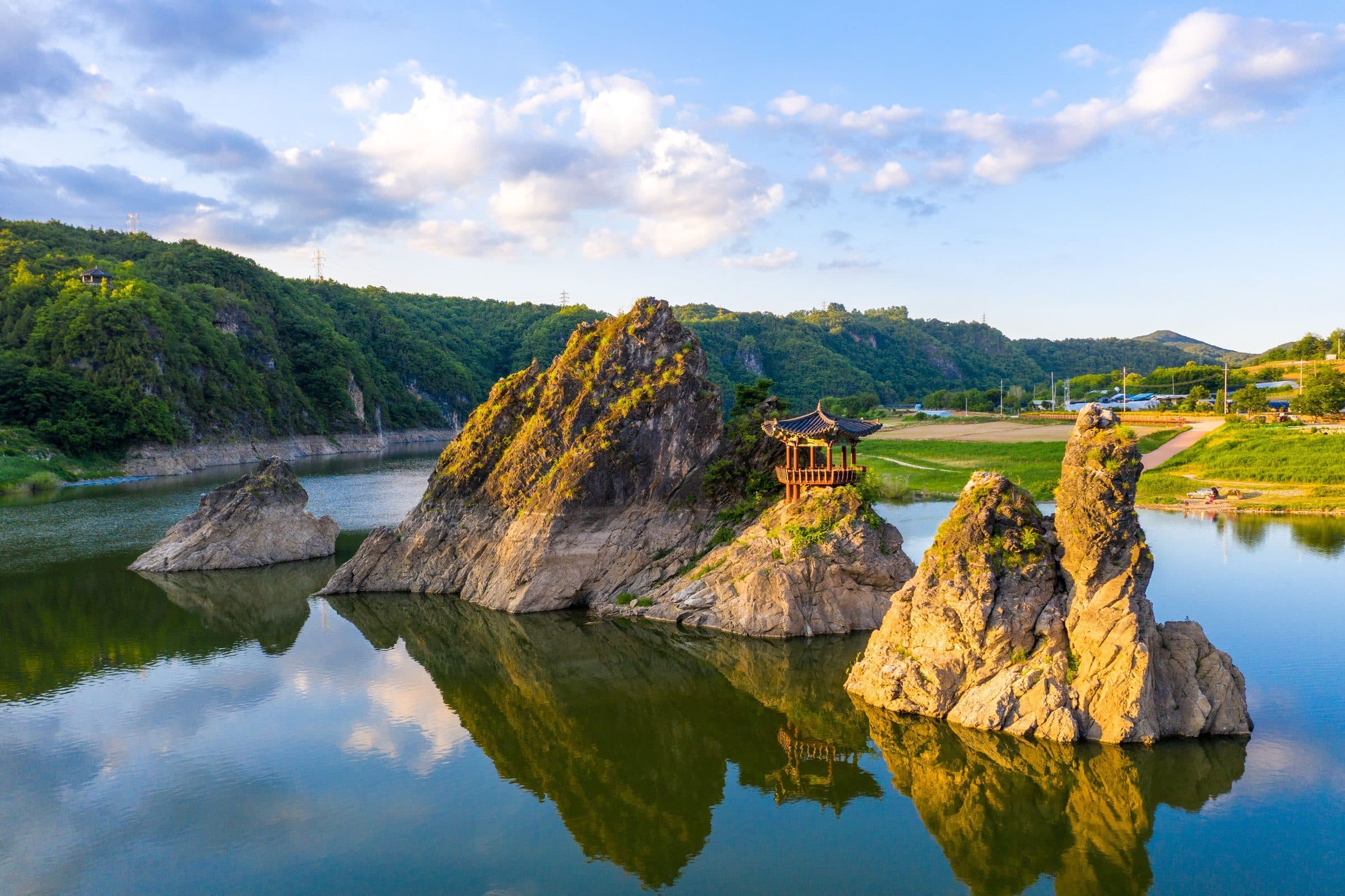Three rock peaks and a pavilion rising from the river at Dodamsambong in Danyang.